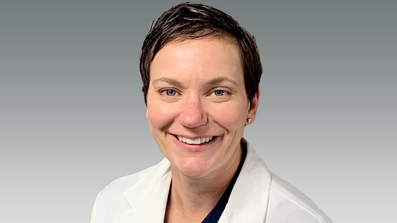 Audrey Stevens in white coat smiling