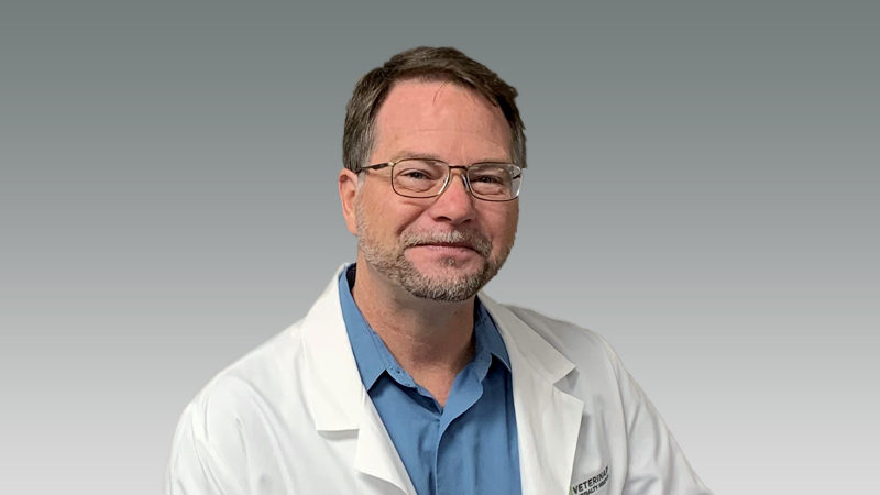 Blaise Burke in white coat smiling