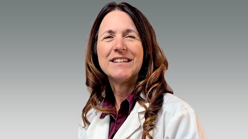 Brenda Phillips in white coat smiling