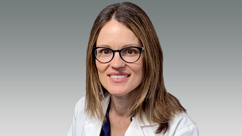 Emily Moeller in white coat smiling