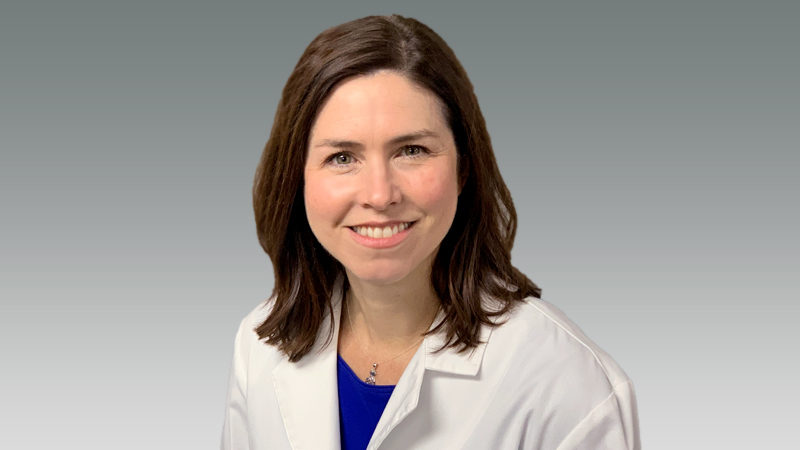 Jennifer DeBerry in white coat smiling
