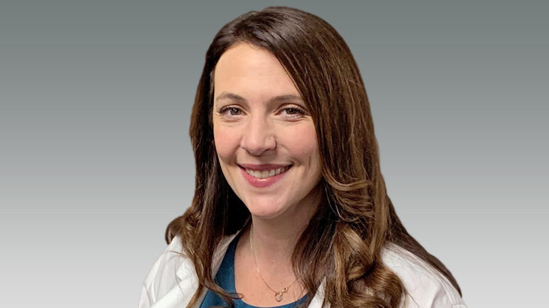 Katy Fryer in white coat smiling